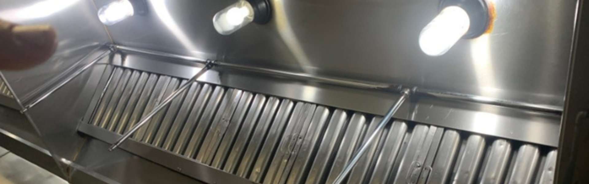 Eureka Commercial Kitchen Hood Cleaning | A‑1 Cleaning Service - A-1 Cleaning Service, LLC. Commercial restaurant hood cleaning in Eureka, CA showing professionally cleaned stainless steel exhaust hood by A‑1 Cleaning Service