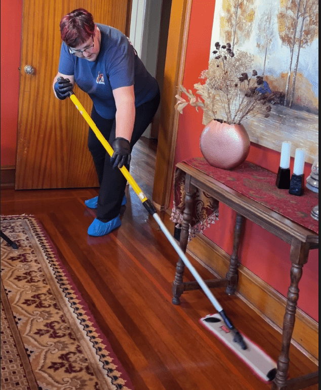 Professional maid service cleaning hardwood floors in a home in Eureka, CA