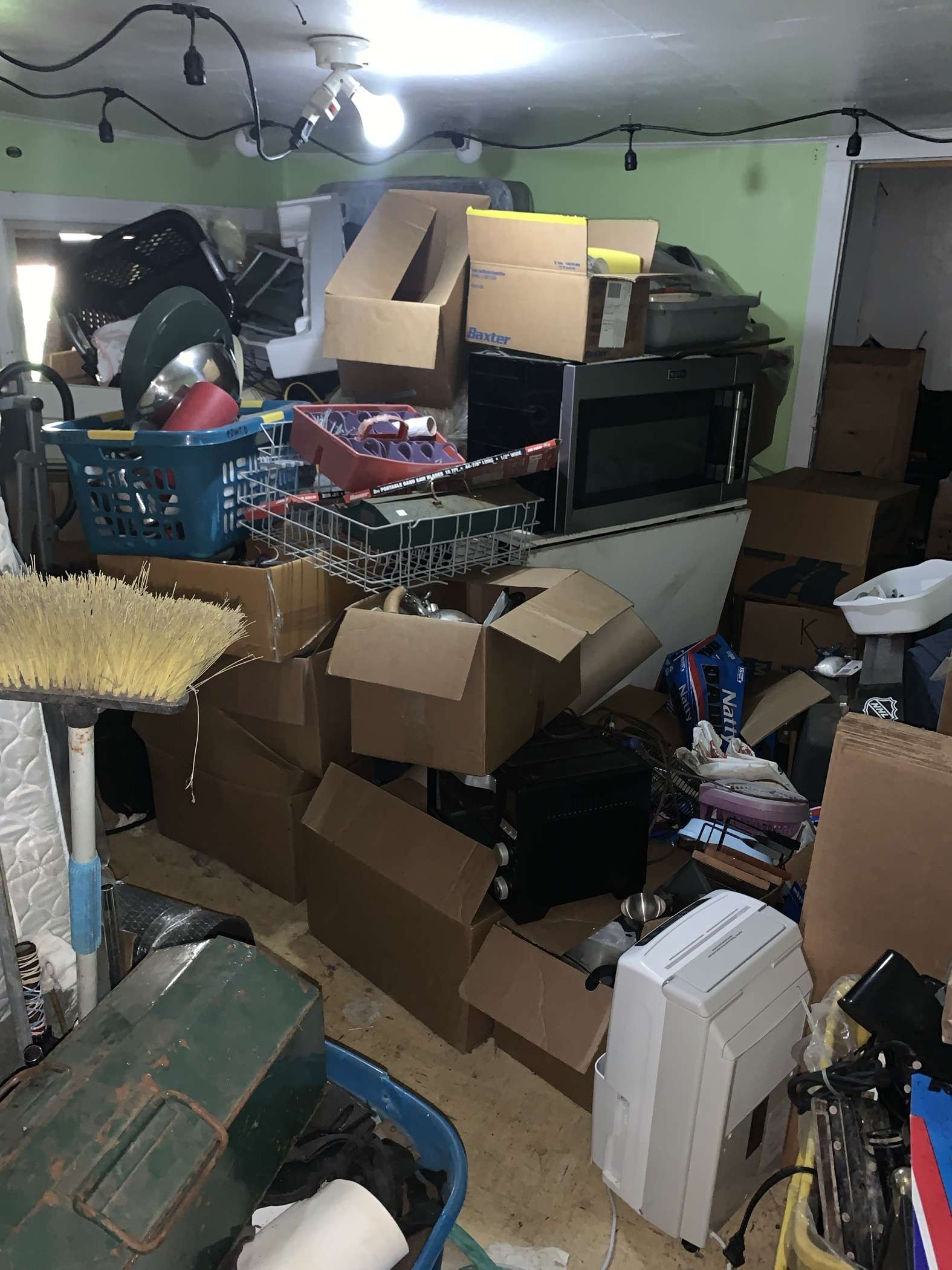 Before hoarder cleanup and junk hauling in a cluttered interior space in Fortuna, CA