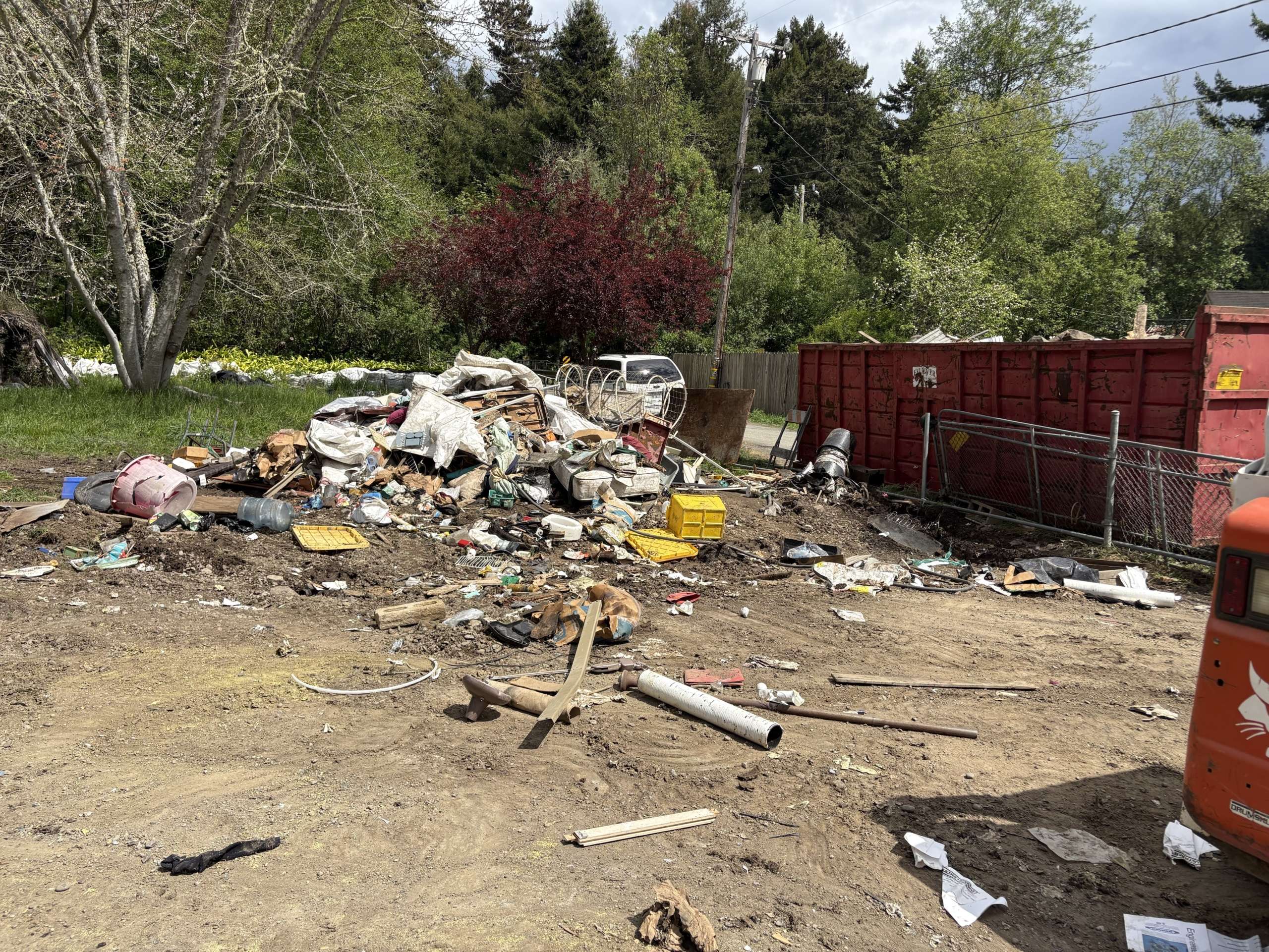 Large pile of debris during a junk hauling and property cleanout project in Fortuna, CA