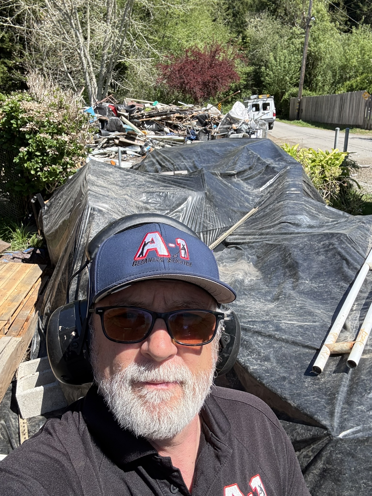 On‑site project manager overseeing a hoarder cleanup and junk hauling project in Fortuna, CA